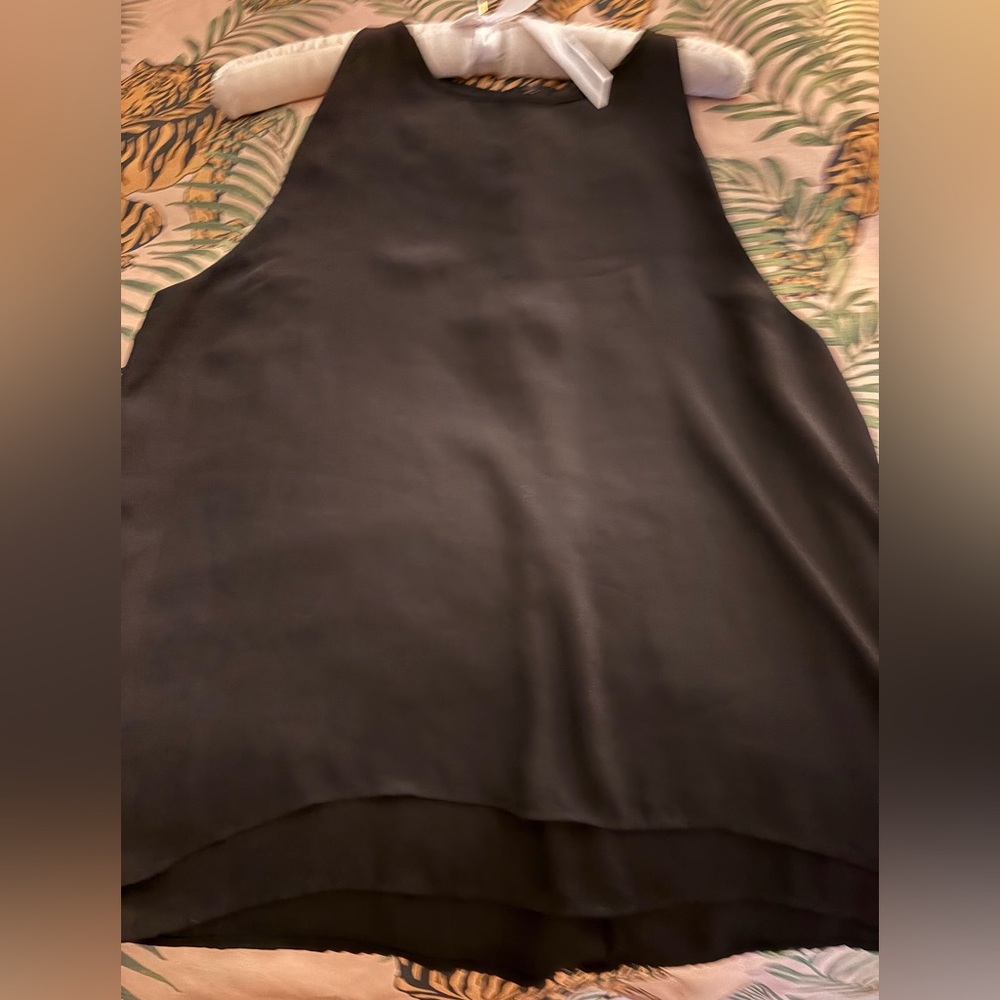 Aqua A line flowy top. Never worn but great condition. Very easy to wear top.